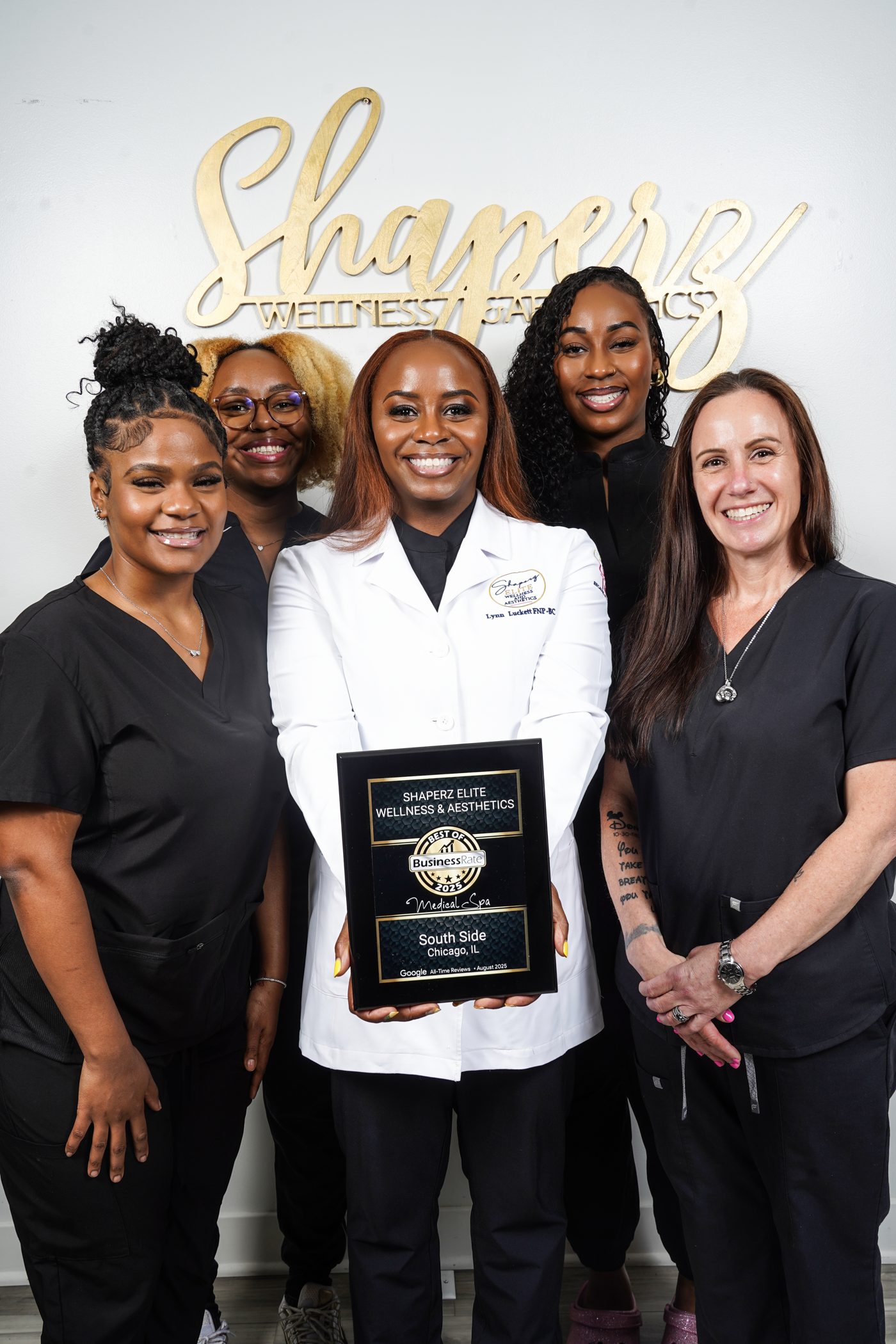 Shaperz Elite Wellness and Aesthetics team with Lynn St. Victor-Luckett holding the Best of 2025 Medical Spa award